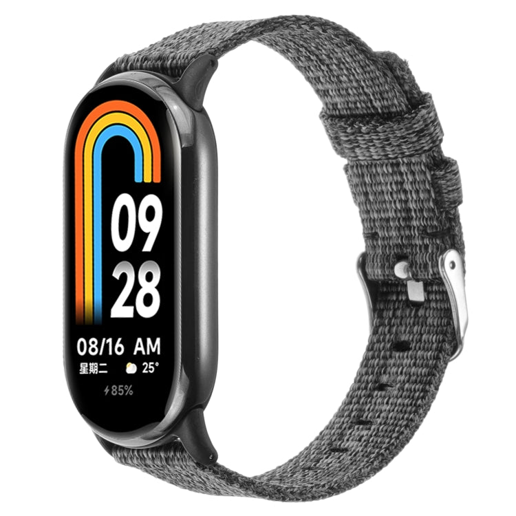 Grey nylon canvas watch band with metal buckle and adjustable strap holes