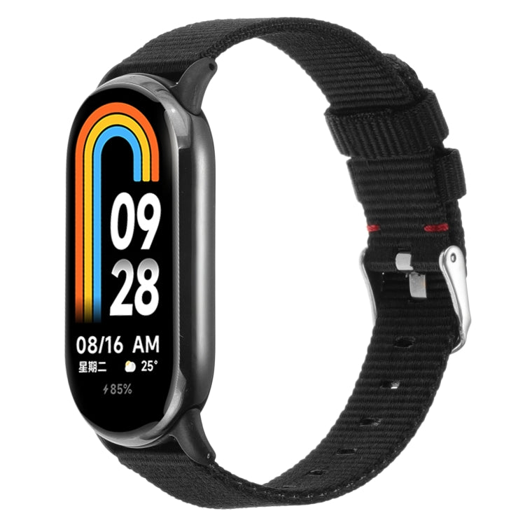 Black nylon canvas watch band with metal buckle and adjustable strap holes