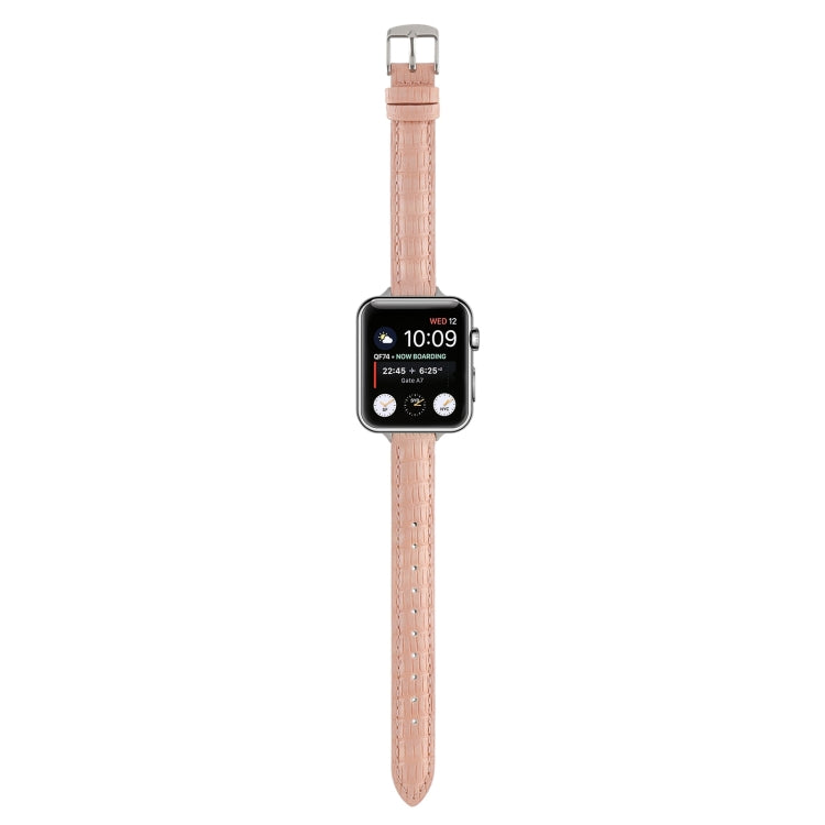 Pink crocodile leather watch band with silver buckle and stitched strap holes