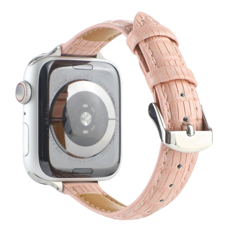 Pink crocodile leather watch band with silver buckle, stitched holes, and textured pattern
