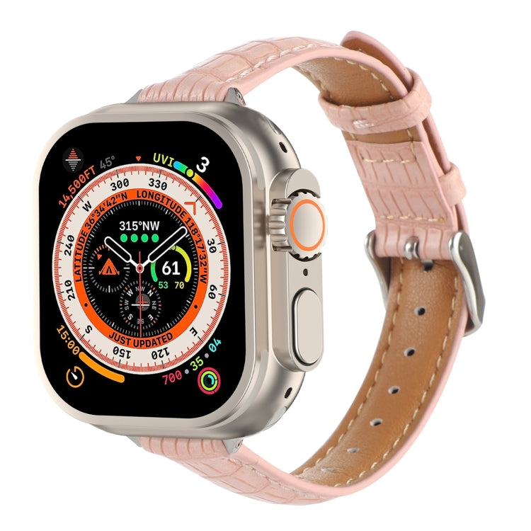 Pink crocodile leather watch band with stitched edges and buckle holes