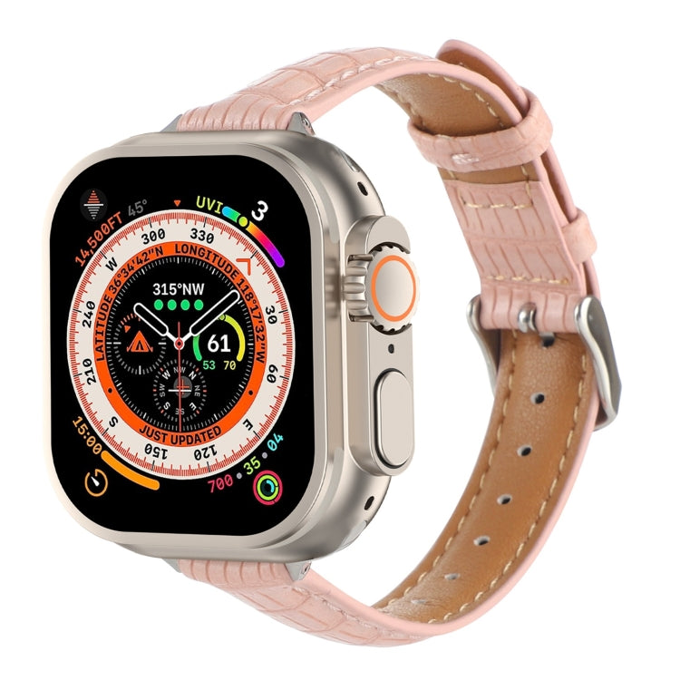 Pink crocodile leather Apple Watch band with stitched holes and buckle.