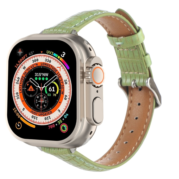 Green crocodile leather Apple Watch band with stitched holes and buckle.