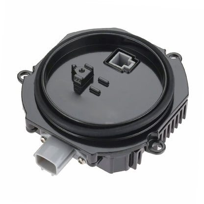 HID ballast module with black circular housing and electrical connectors