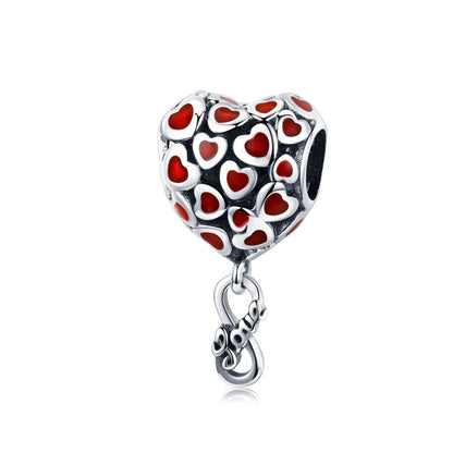 Silver heart charm bead with red heart enamel pattern and dangling clasp loop