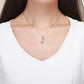 Silver violin pendant necklace with zircon detail
