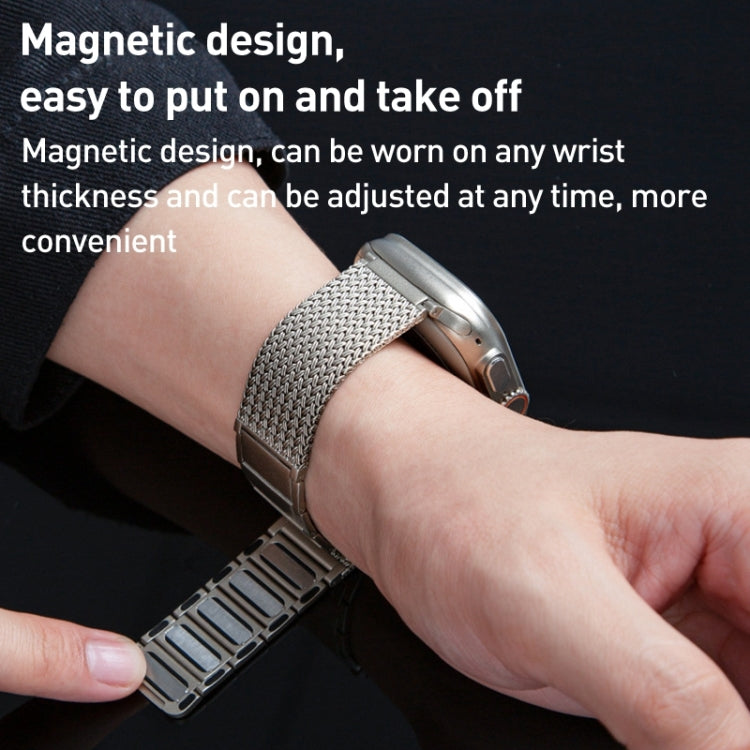 Stainless steel braided watch band with magnetic clasp on wrist, silver mesh link strap