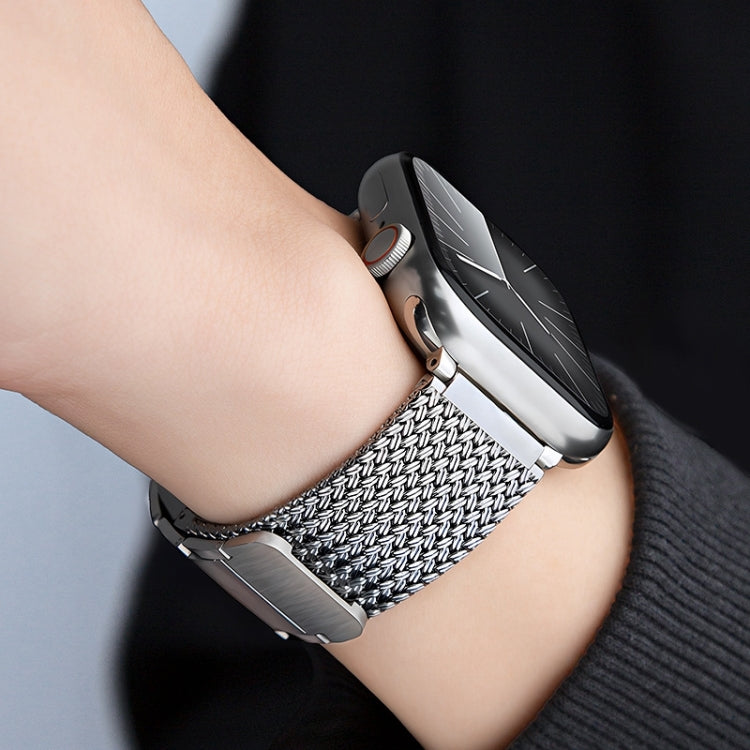 Stainless steel braided watch band with magnetic clasp, silver woven texture on wrist
