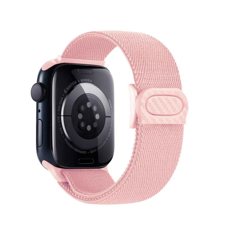 Light pink nylon watch band with snap closure, shown from the back on an Apple Watch