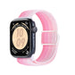 Pink gradient nylon watch band with snap buckle, shown on an Apple Watch