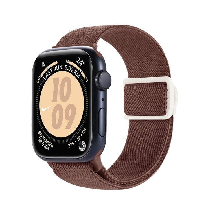 Brown nylon Apple Watch band with white snap buckle, shown attached to a watch