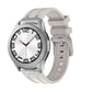Light gray silicone watch band shown on a silver watch with a ridged strap and buckle.