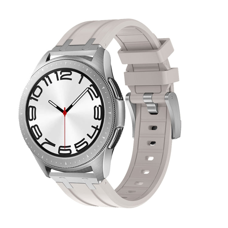 Light gray silicone watch band shown on a silver watch with a ridged strap and buckle.