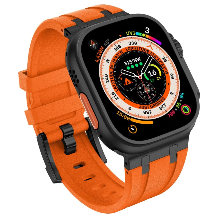 Orange silicone watch band with black buckle and smartwatch in angled view