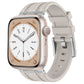 Apple Watch with light gray silicone band and silver-tone hardware