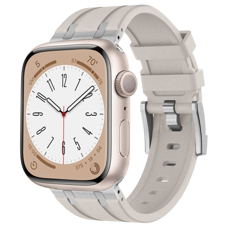 Apple Watch with light gray silicone band and silver-tone hardware