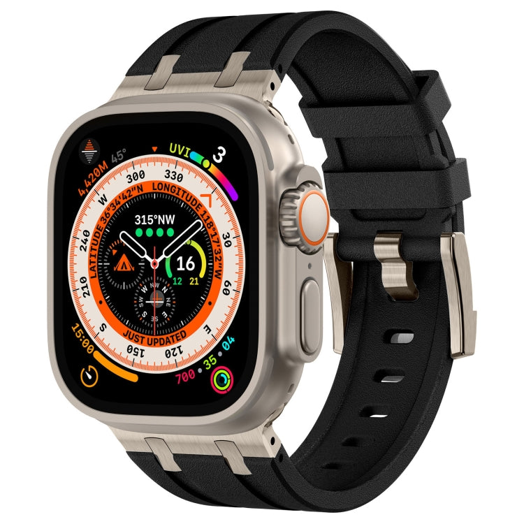 Black liquid silicone watch band with warm metal connectors on a light metal smartwatch.