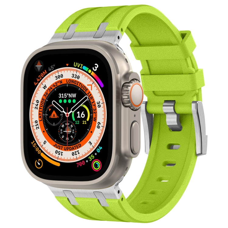 Apple Watch with bright green silicone band and metal connectors