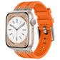 Apple Watch with an orange liquid silicone band and silver-tone buckle