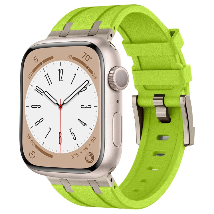 Apple Watch with a bright green liquid silicone band and silver-tone buckle