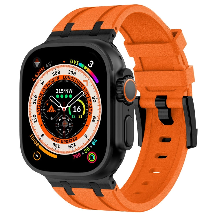 Apple Watch with an orange silicone band and black-tone buckle
