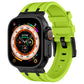 Apple Watch with a bright green silicone band and black-tone buckle