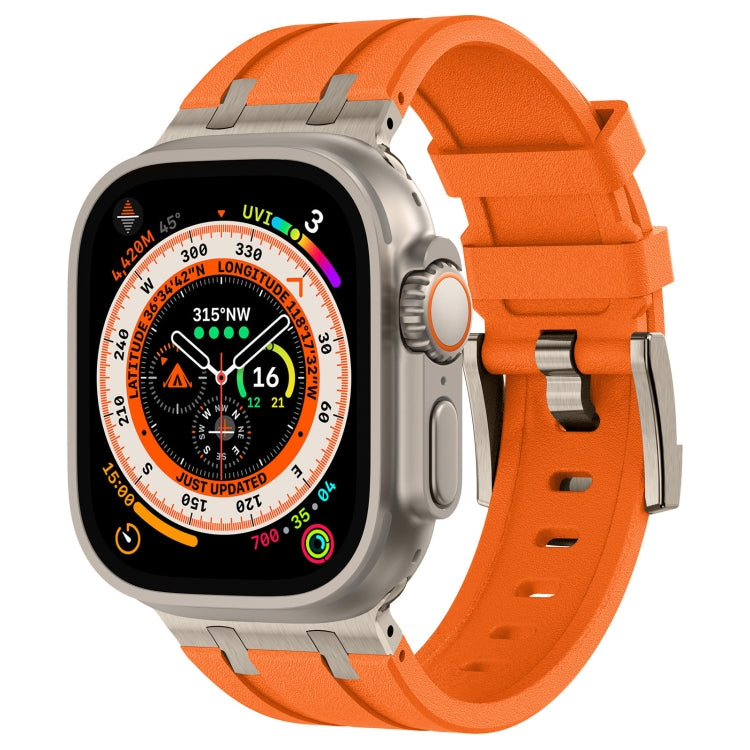 Apple Watch silicone band in orange with silver connectors and a textured finish