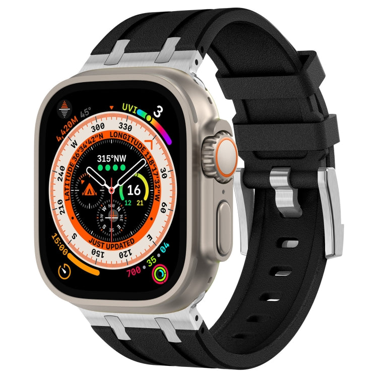 Black Apple Watch silicone band with silver connectors and a textured finish