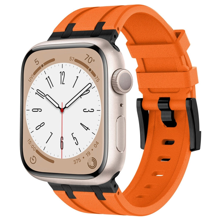 Orange Apple Watch silicone band with black connectors and a textured finish