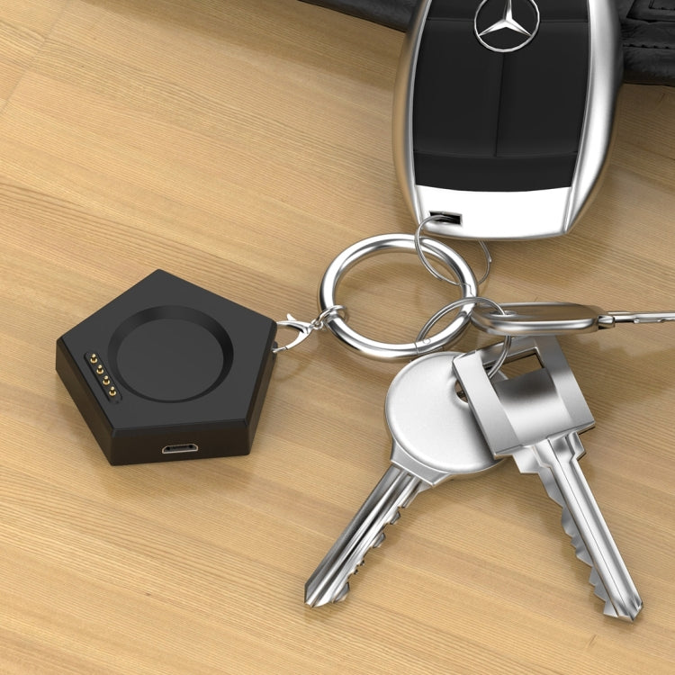 Black keychain smartwatch charger attached to a set of keys