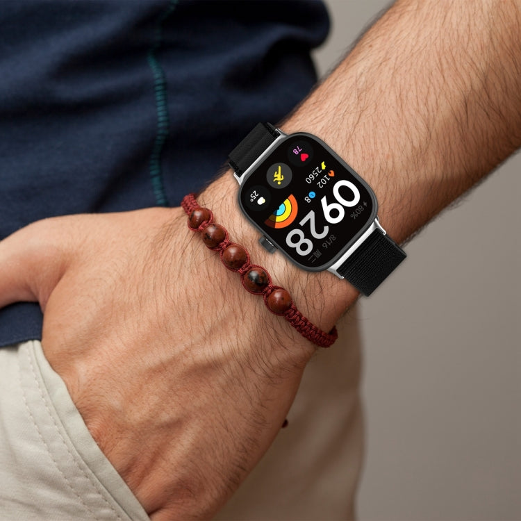 Black nylon loop watch band fitted to a smartwatch on a wrist