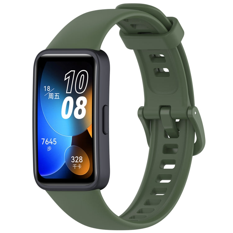 Dark green silicone watch band with buckle, shown on a Huawei fitness tracker