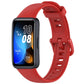 Red silicone watch band with buckle, shown on a Huawei fitness tracker