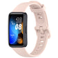 Light pink silicone watch band with buckle, shown on a Huawei fitness tracker