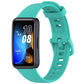Teal silicone watch band fitted to a black Huawei Band fitness tracker