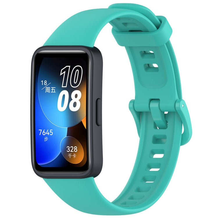 Teal silicone watch band fitted to a black Huawei Band fitness tracker