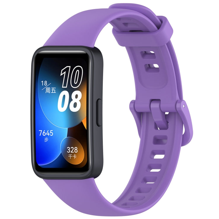 Purple silicone watch band fitted to a black Huawei Band fitness tracker