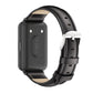 Back view of black leather watch band with beige lining and silver buckle