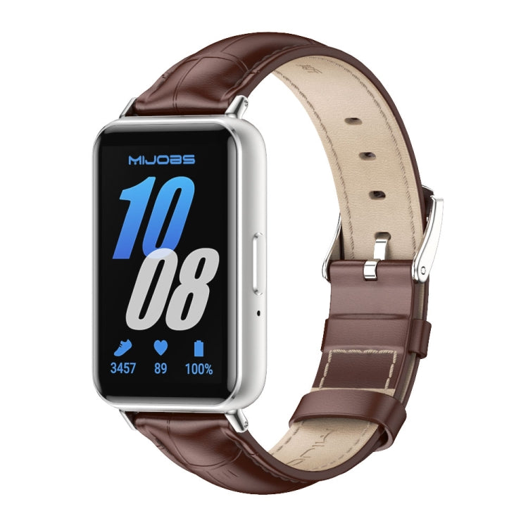 Brown dual-sided leather watch band with tan lining and silver buckle, shown on a Galaxy Fit 3