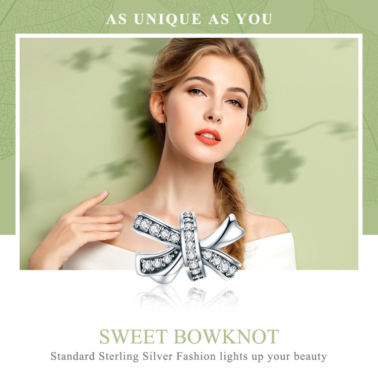 Sterling silver bow knot charm bead with crystal details