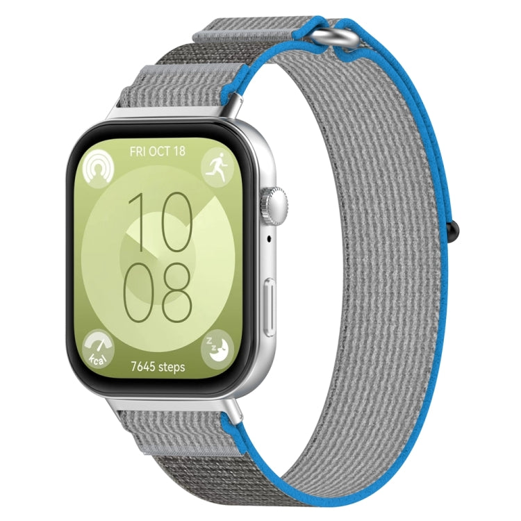 Nylon loop watch band with gray fabric and bright blue edging on a smartwatch