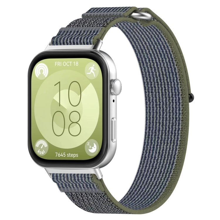 Loop nylon watch band in gray and navy with olive edging, shown on a silver watch