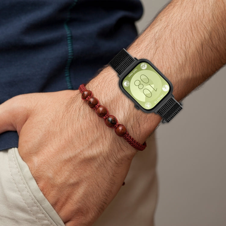 Black nylon loop watch band worn on a wrist