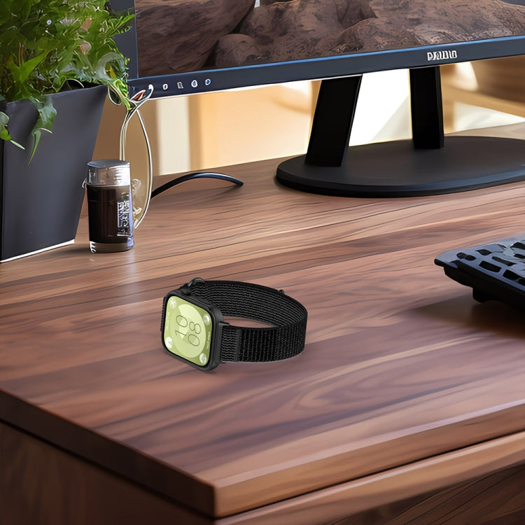 Black nylon loop watch band with smartwatch, showing its adjustable fabric strap