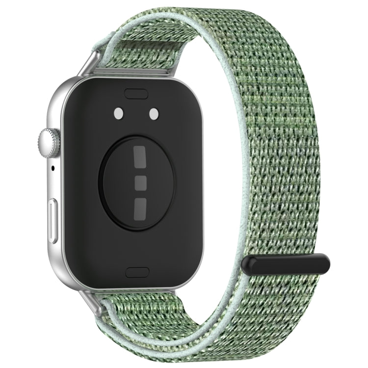 Sage green nylon watch band with hook-and-loop closure, shown from the back