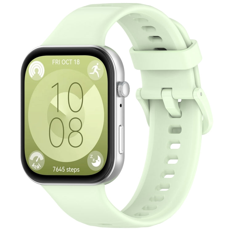 Pale green silicone sports watch band with buckle, shown attached to a smartwatch
