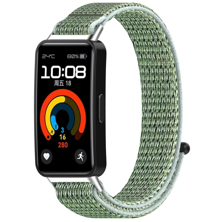 Green nylon hook-and-loop watch band shown attached to a fitness tracker