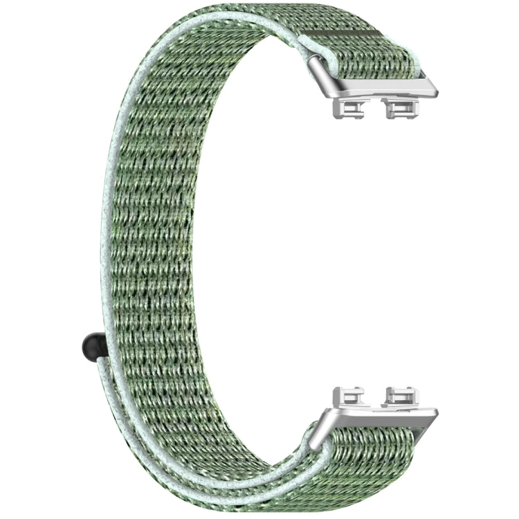 Green nylon hook-and-loop watch band with metal connectors, shown unattached
