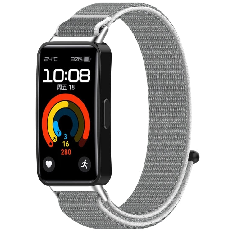 Gray nylon hook-and-loop watch band shown attached to a fitness tracker