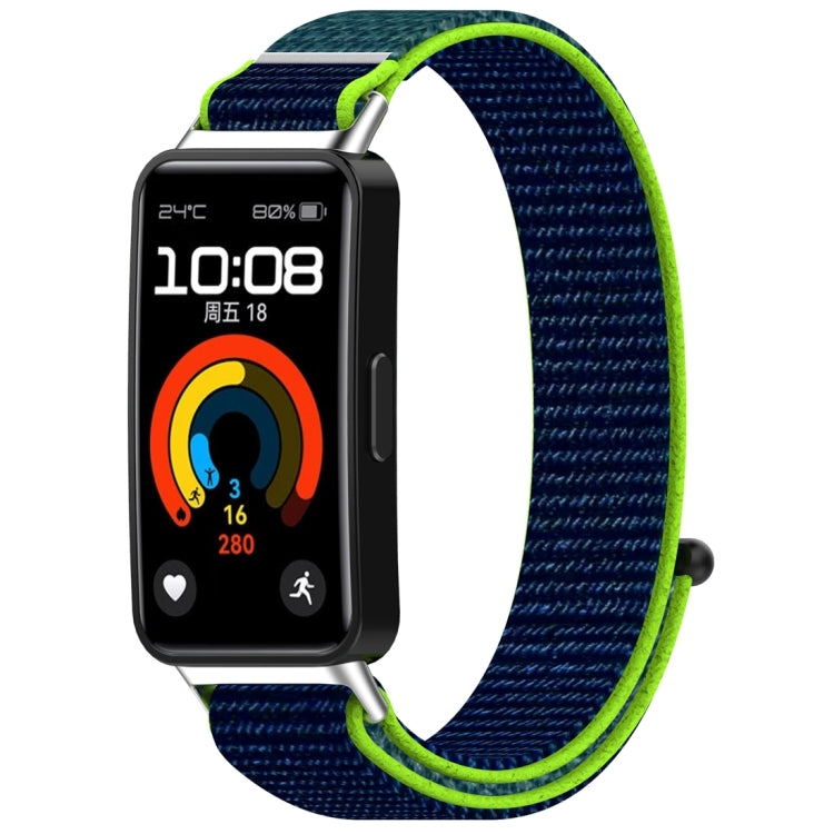 Navy nylon watch band with bright green edging, attached to a fitness tracker